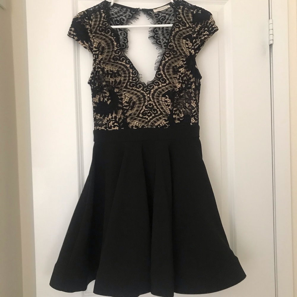 Black Open Back Dress by Chelsea.